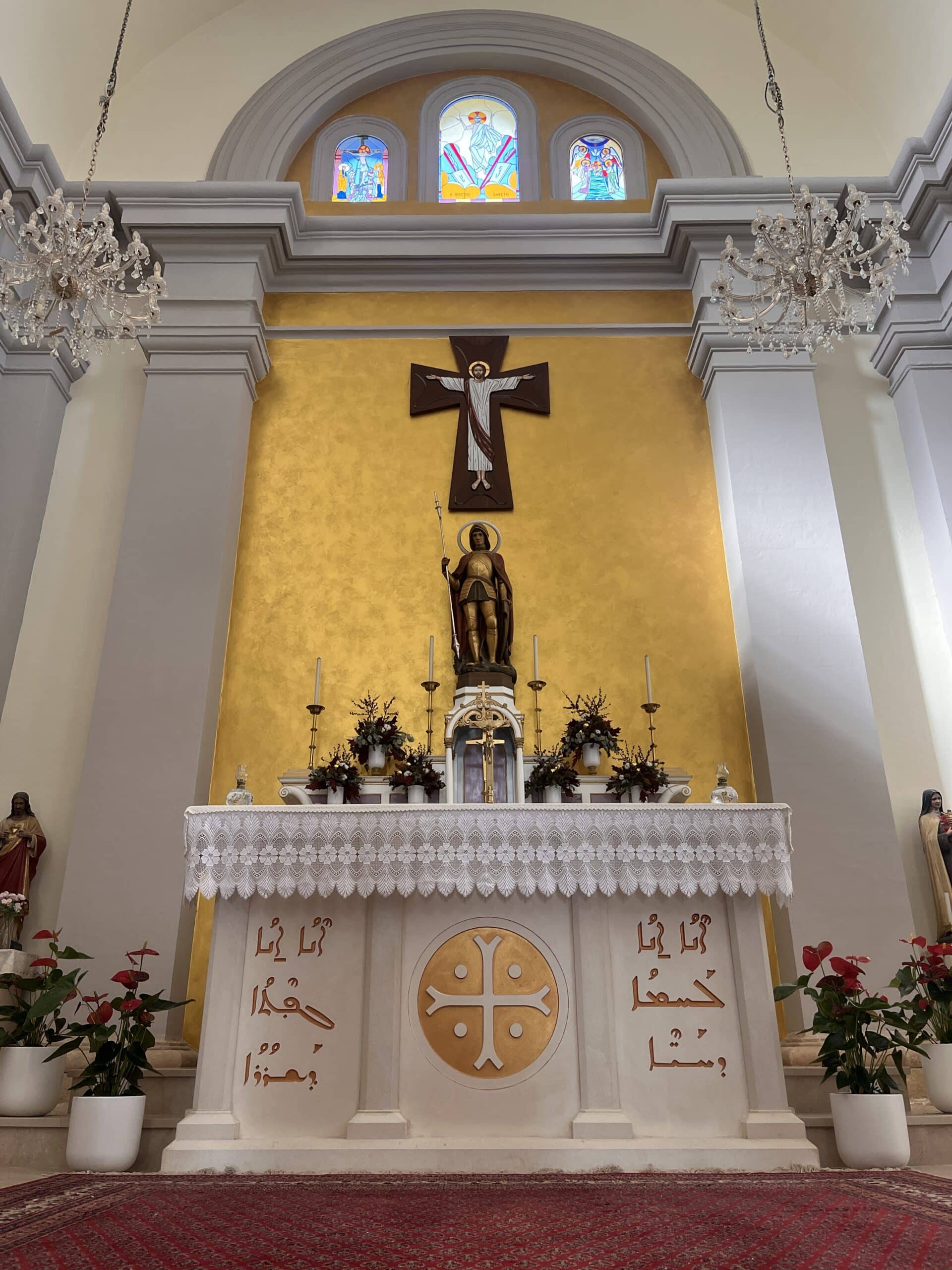 feature tom a statue of saint george on the altar