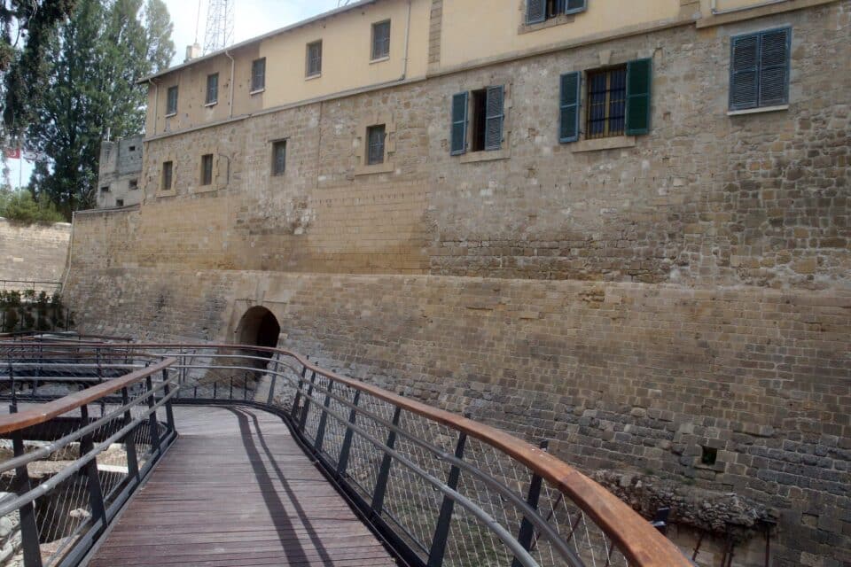 The new pedestrian bridge leading to the original Paphos gate with the old police station on top