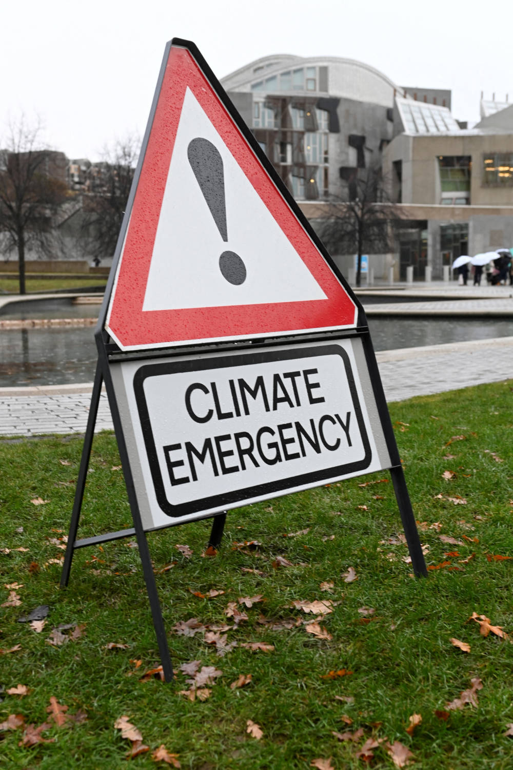 UK judge dismisses case against climate activist who held up sign outside trial
